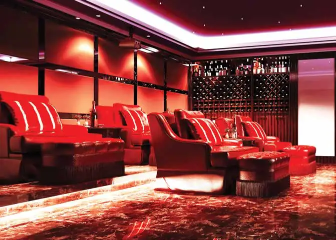 Private cinema lounge with recliner seating in the Vaishnavi Houdini clubhouse