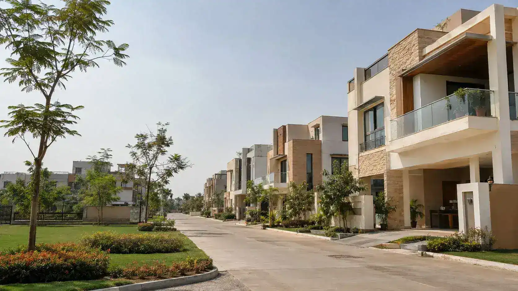 Row of premium villas along a gated community avenue in Hyderabad